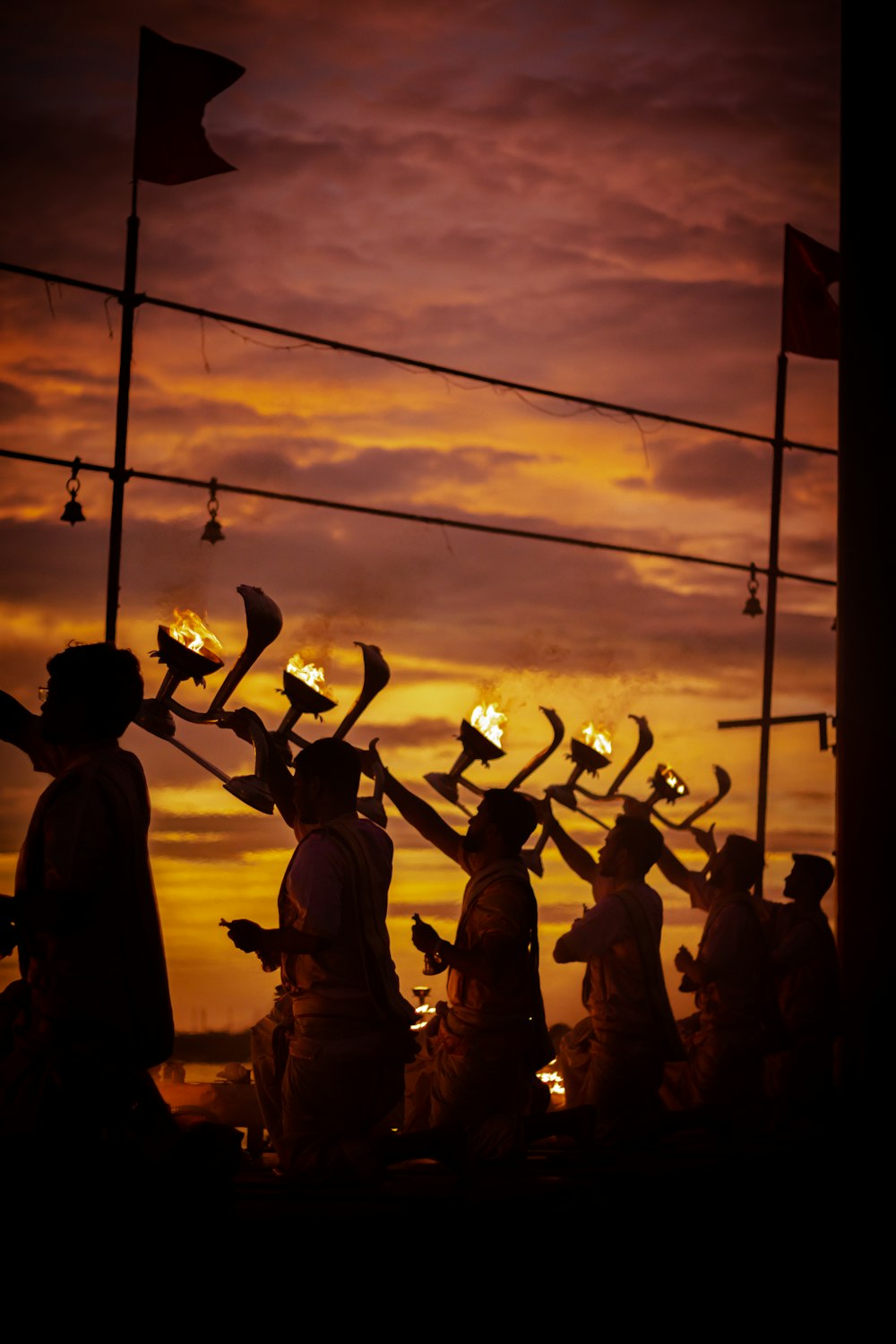 silhouette of people holding flags