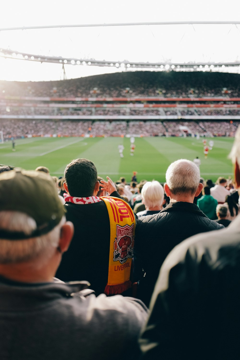 a group of people watching a football game