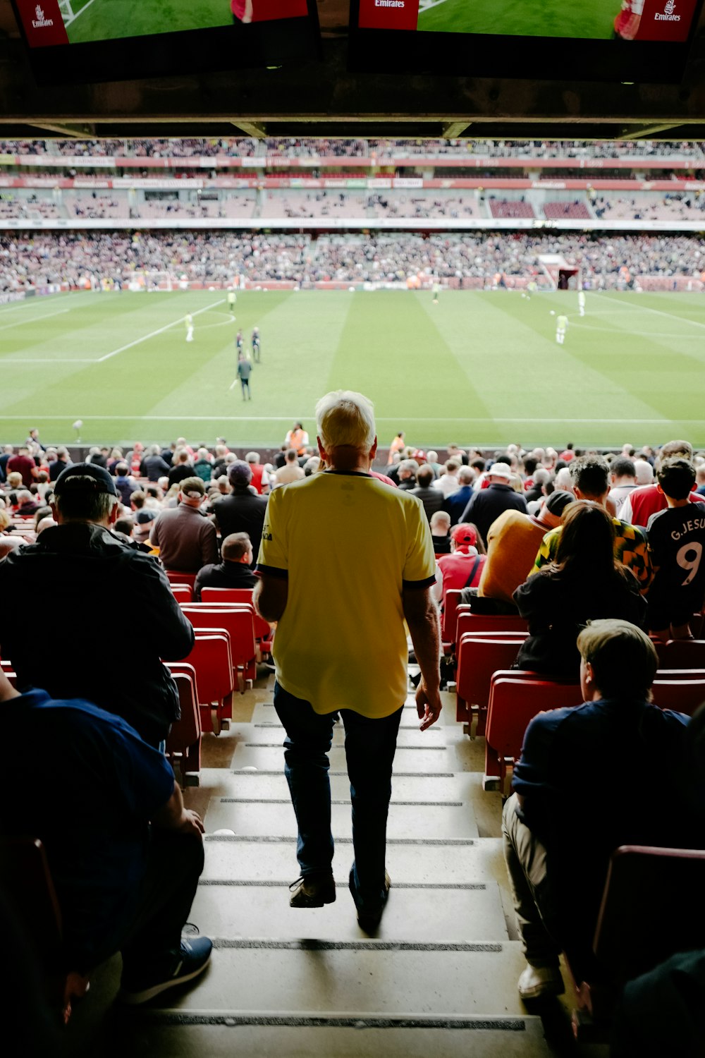 a person walking on a football field