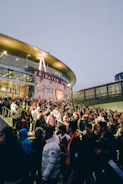 a crowd of people outside a stadium
