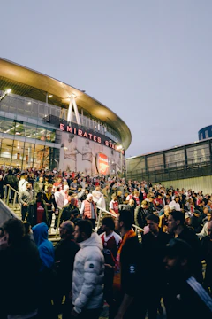 a crowd of people outside a stadium