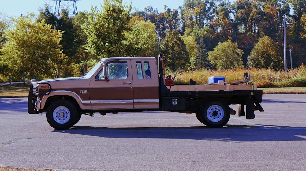 Work truck with a trailer serviced at Rios Tire Shop