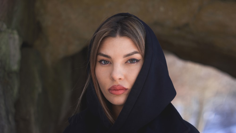 a woman wearing a black hoodie