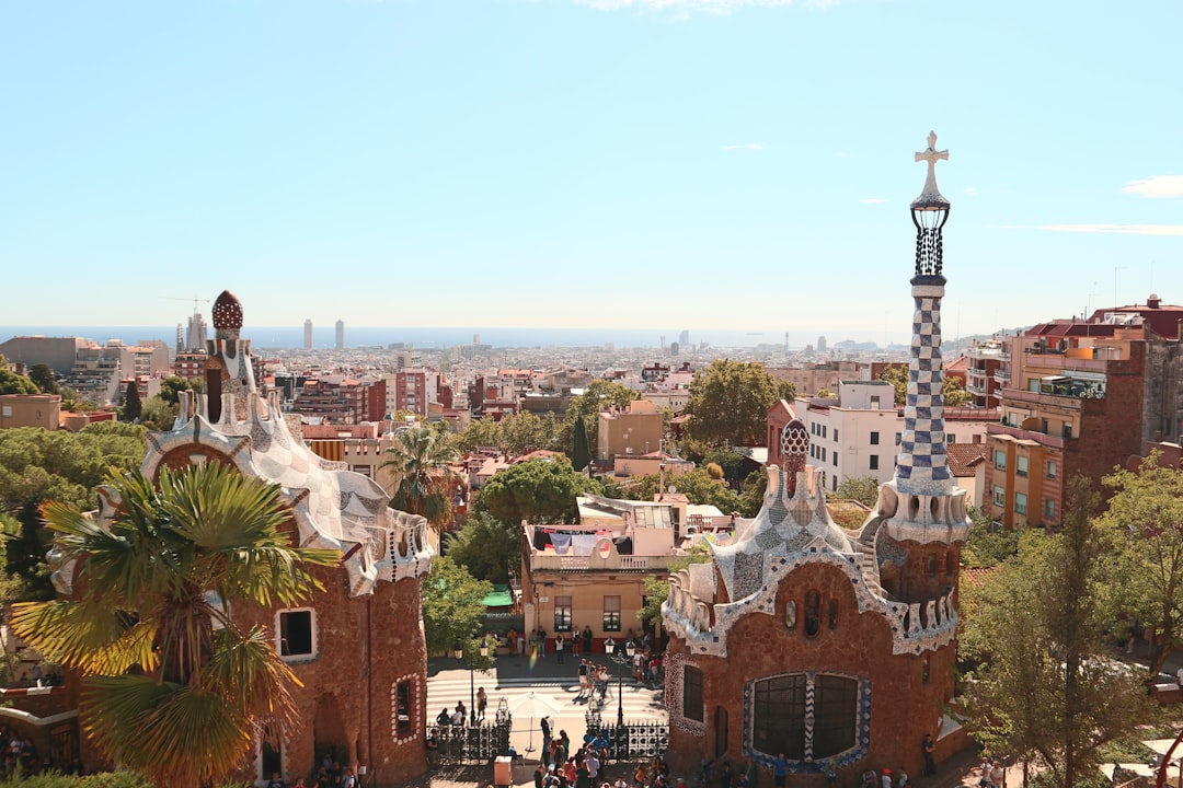 Park Güell with many buildings and trees,