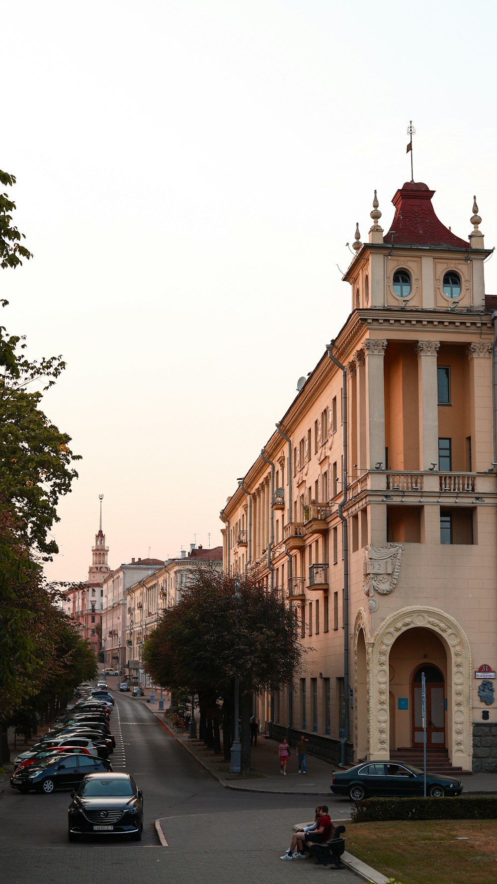 a street with cars and buildings on the side