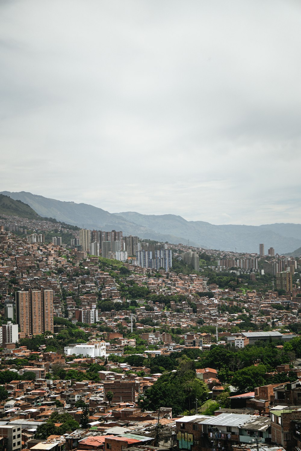 a city with mountains in the background