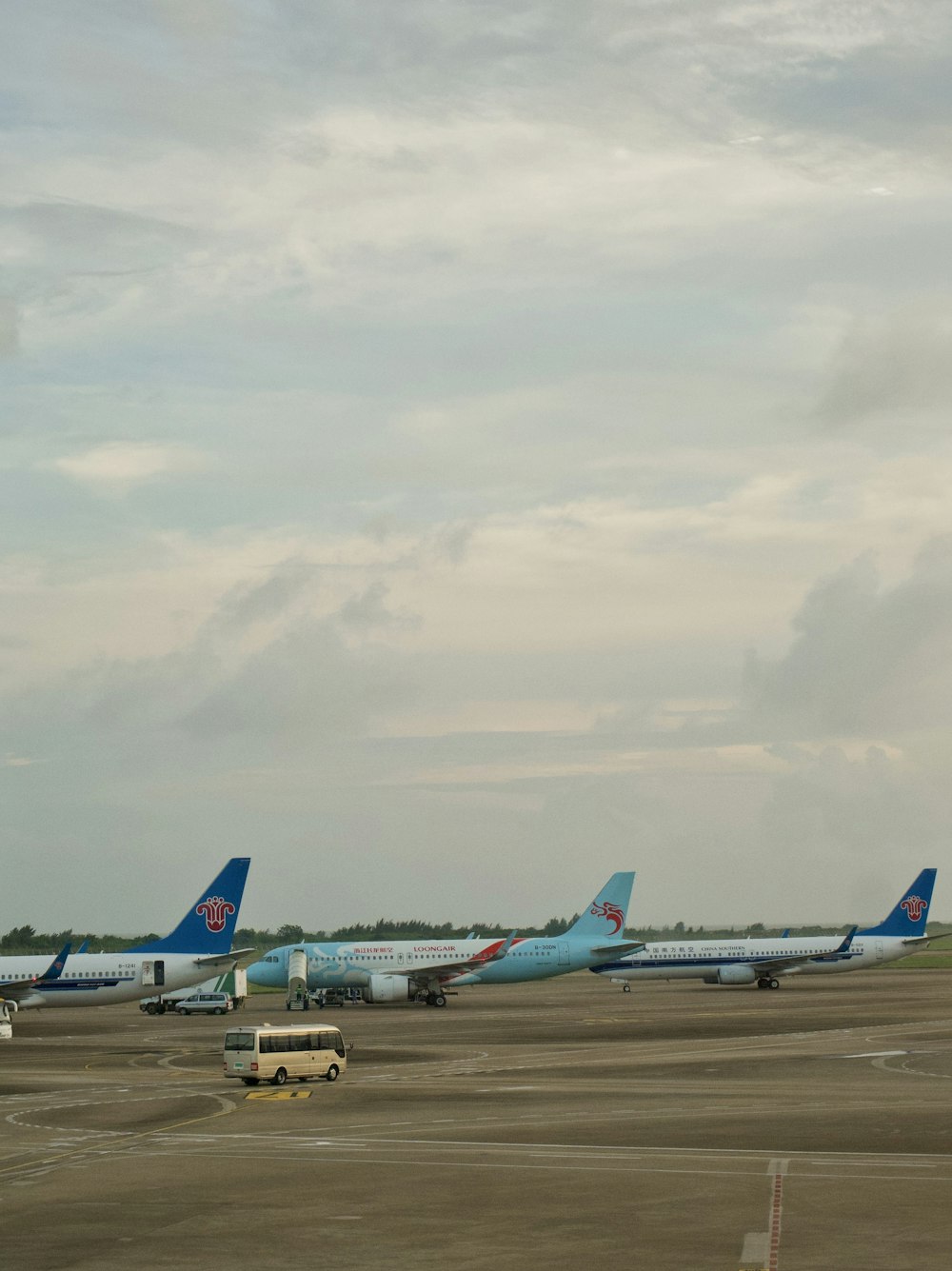 a group of airplanes on a runway