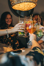 a group of people holding drinks