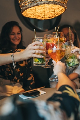 a group of people holding drinks