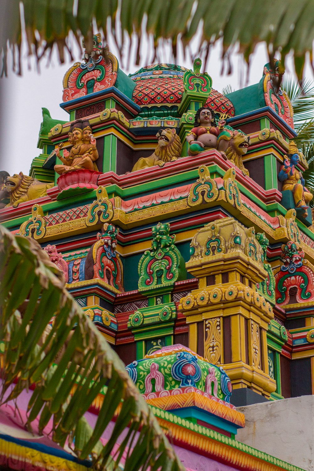 a colorful building with statues