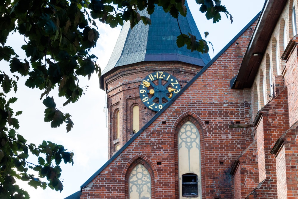 a clock on a brick building