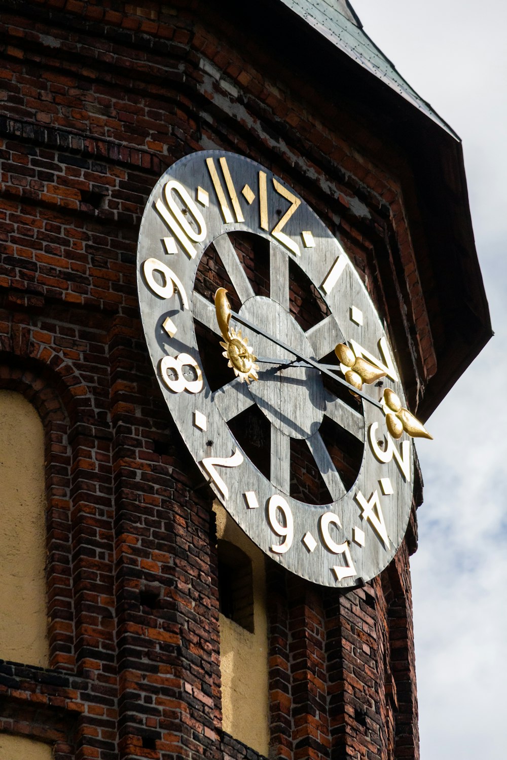 a clock on a brick building