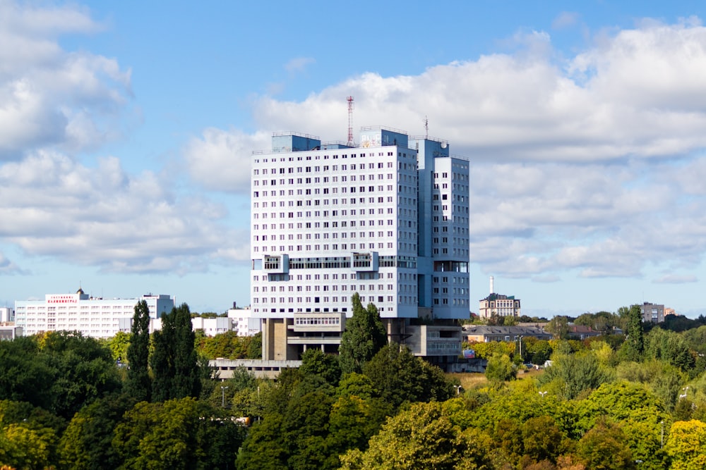 a tall building surrounded by trees