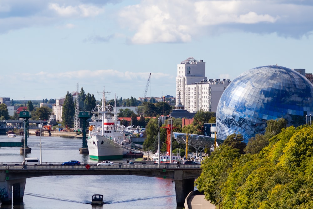 a large globe in front of a city