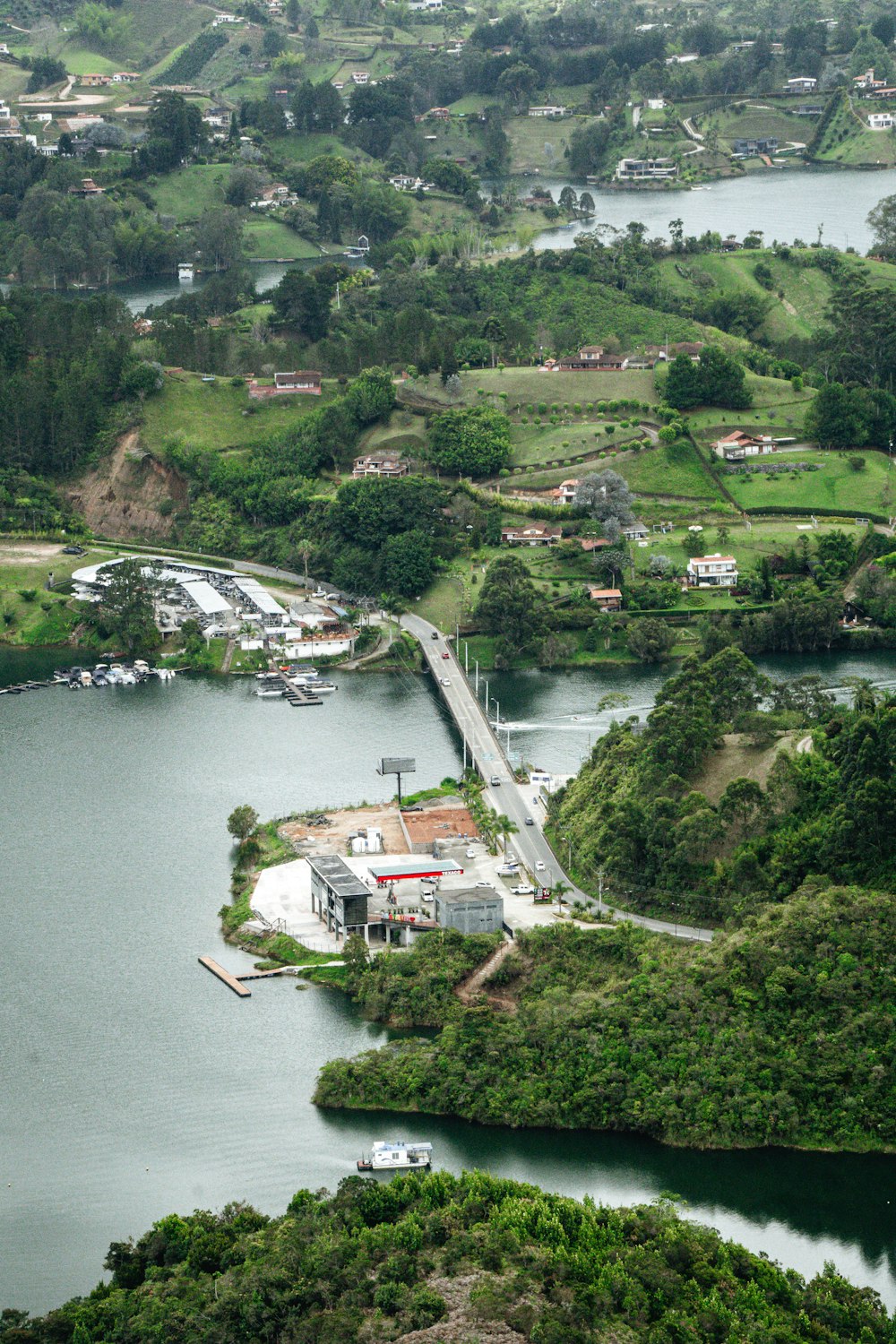 a river with a bridge and buildings