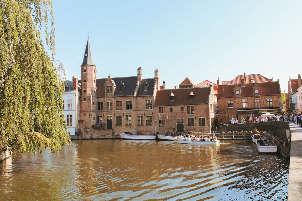 a river with boats and buildings along it