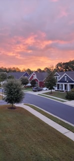 Evening shot of a quiet neighborhood street in California, highlighting well-maintained homes.