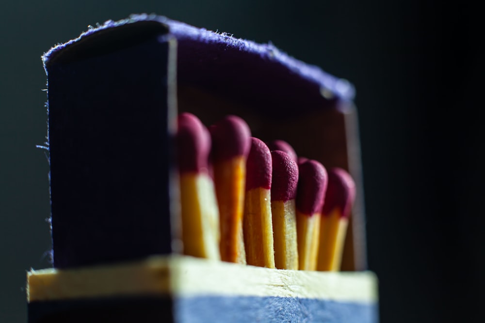 a group of colored pencils in a case