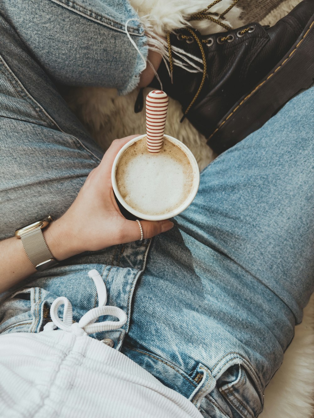 a person holding a cup