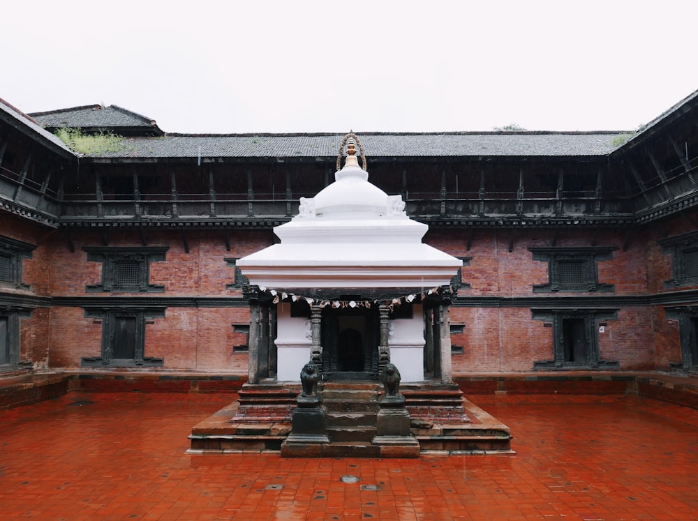 a large building with a fountain in front of it