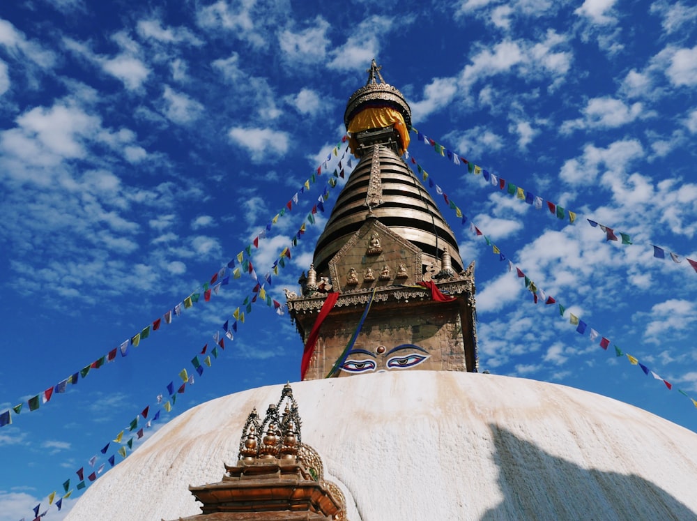 Swayambhunath with a tower and flags