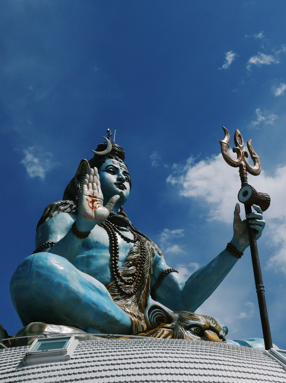 a statue of a person holding a sword and a shield