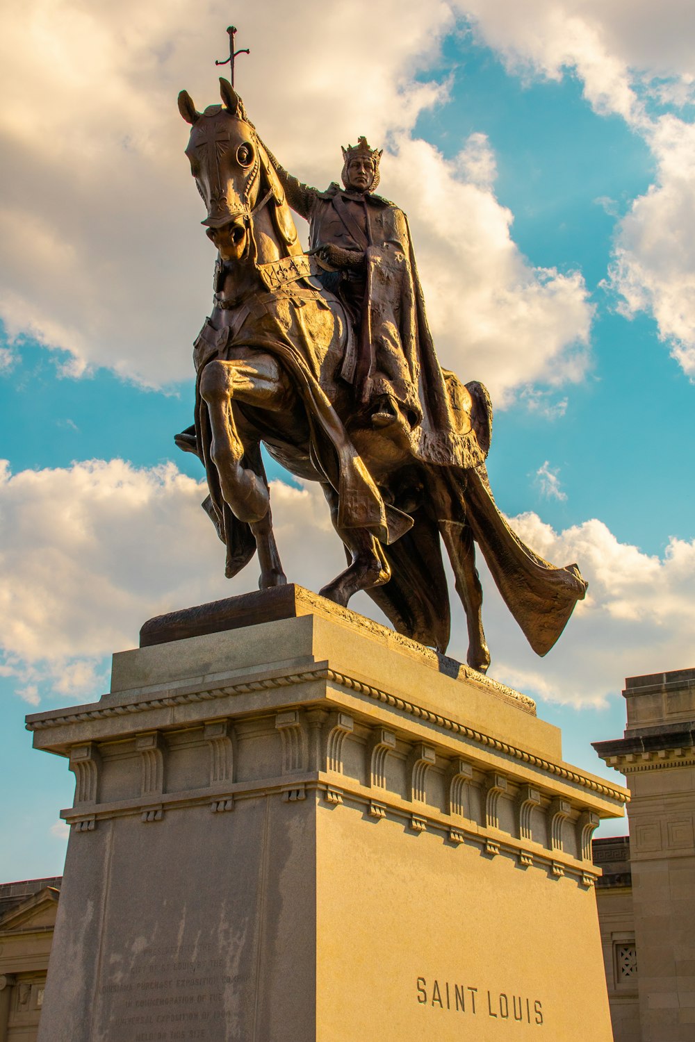 a statue of a person riding a horse