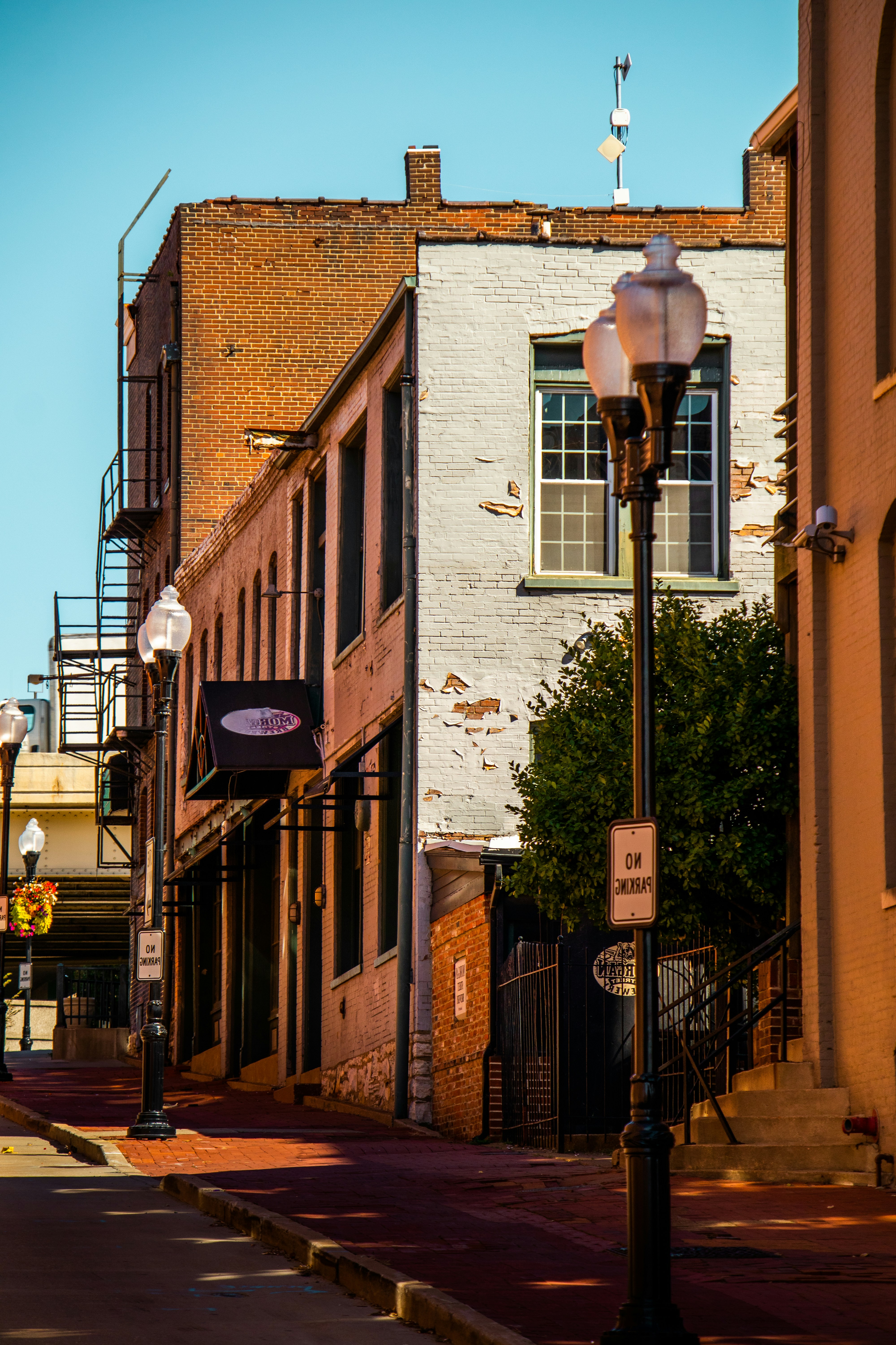 A brick building with a lamp post photo Free Laclede avenue Image on