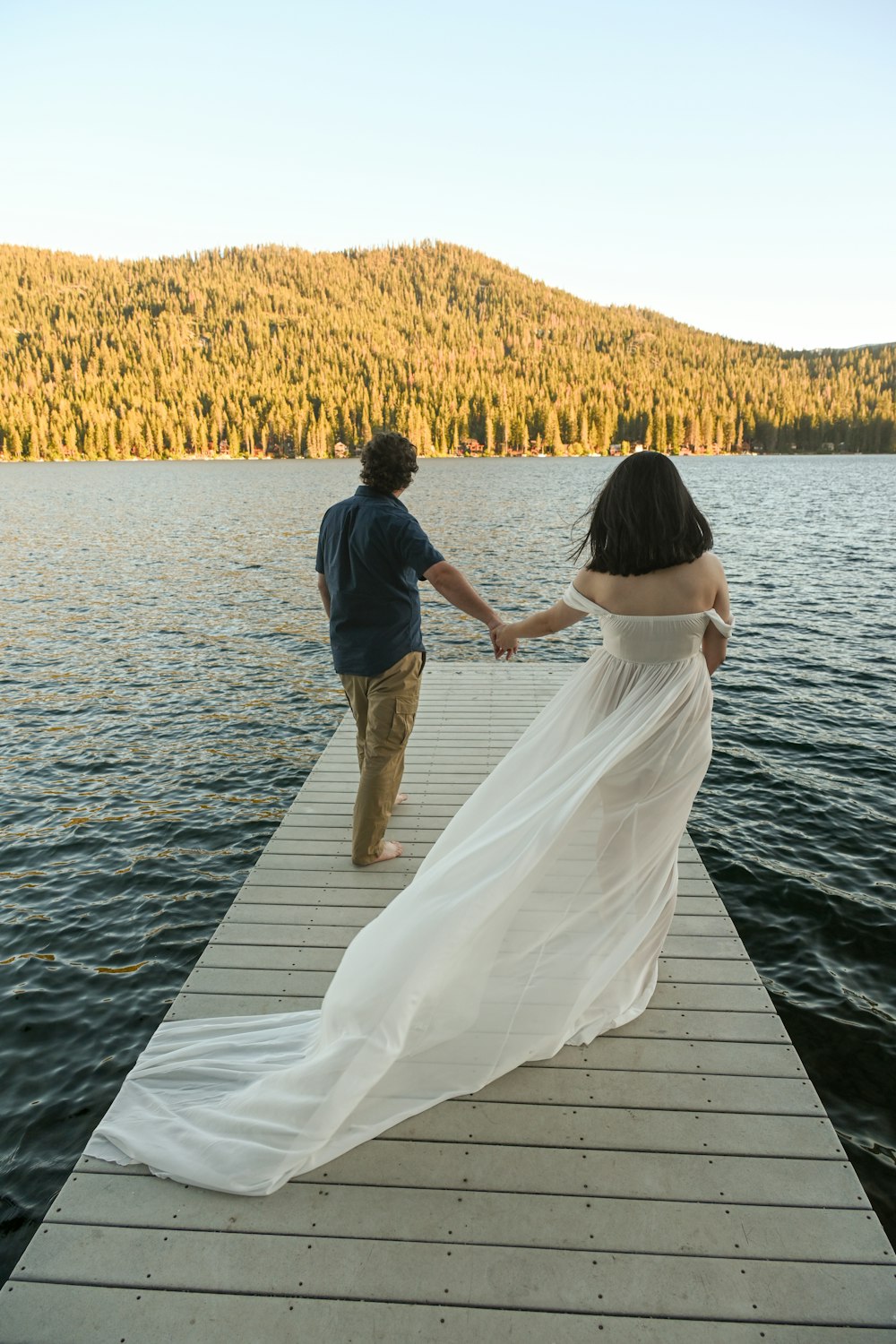 a man and woman on a dock