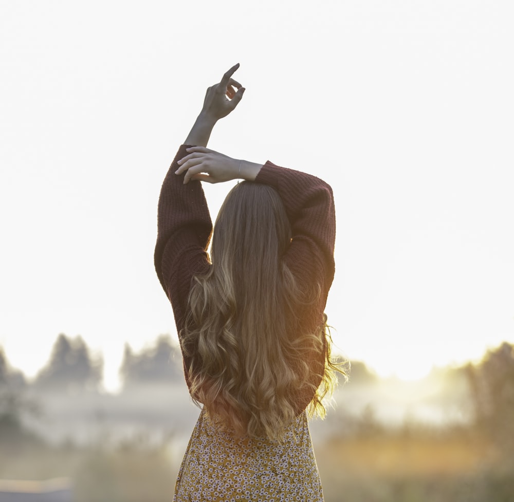 a person with the hair in the air