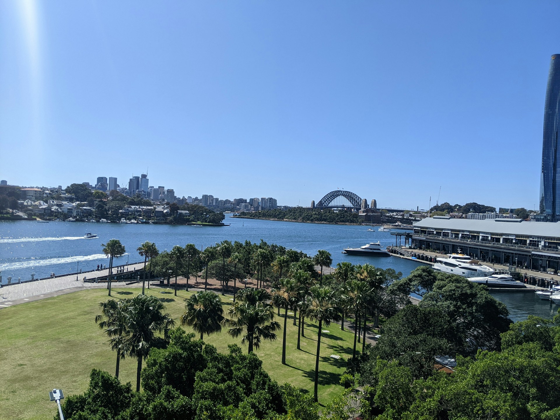 a body of water with trees and buildings around it