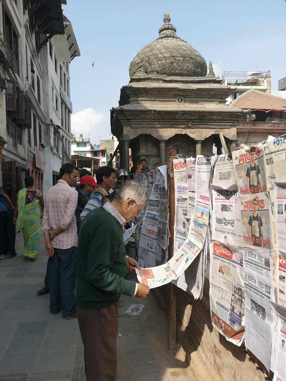 a man reading a newspaper