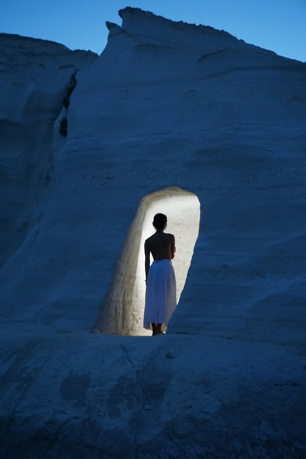 a man standing in a large snowy area