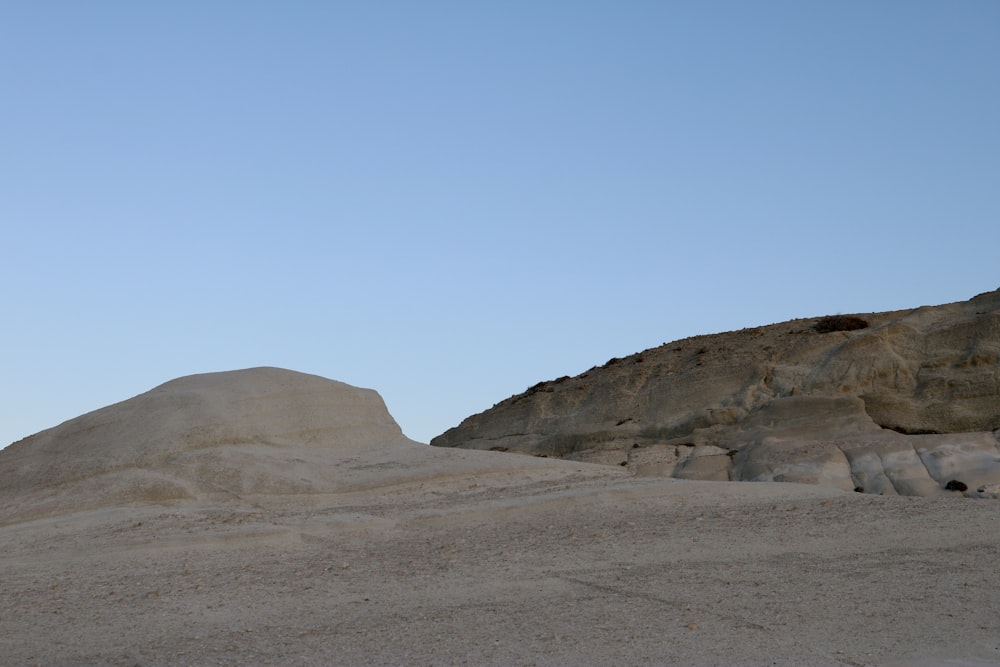 a desert landscape with a hill