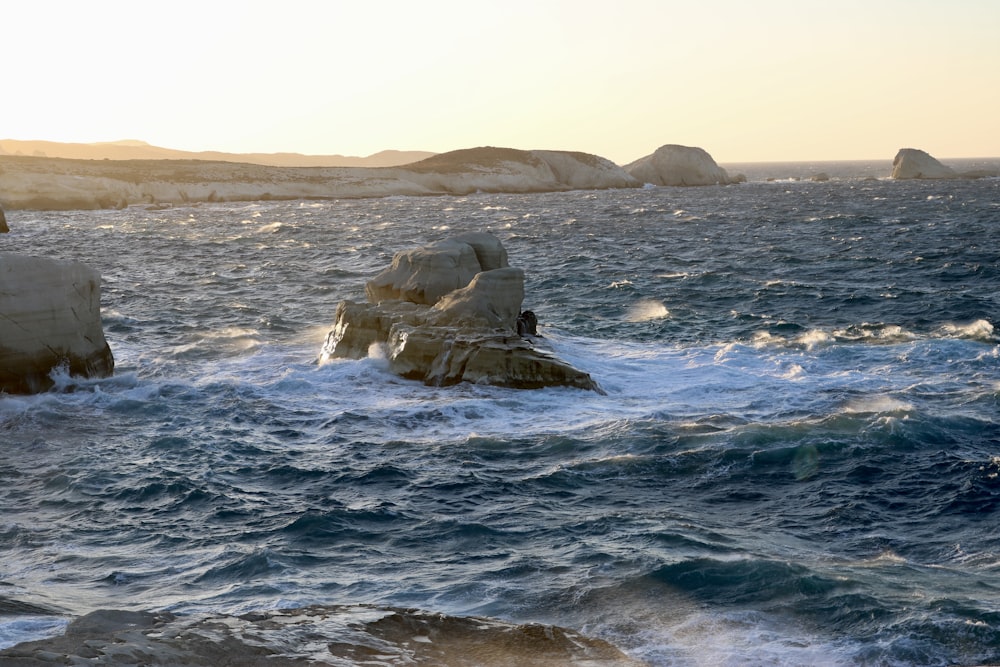 a body of water with rocks in it