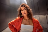 a woman in a red jacket