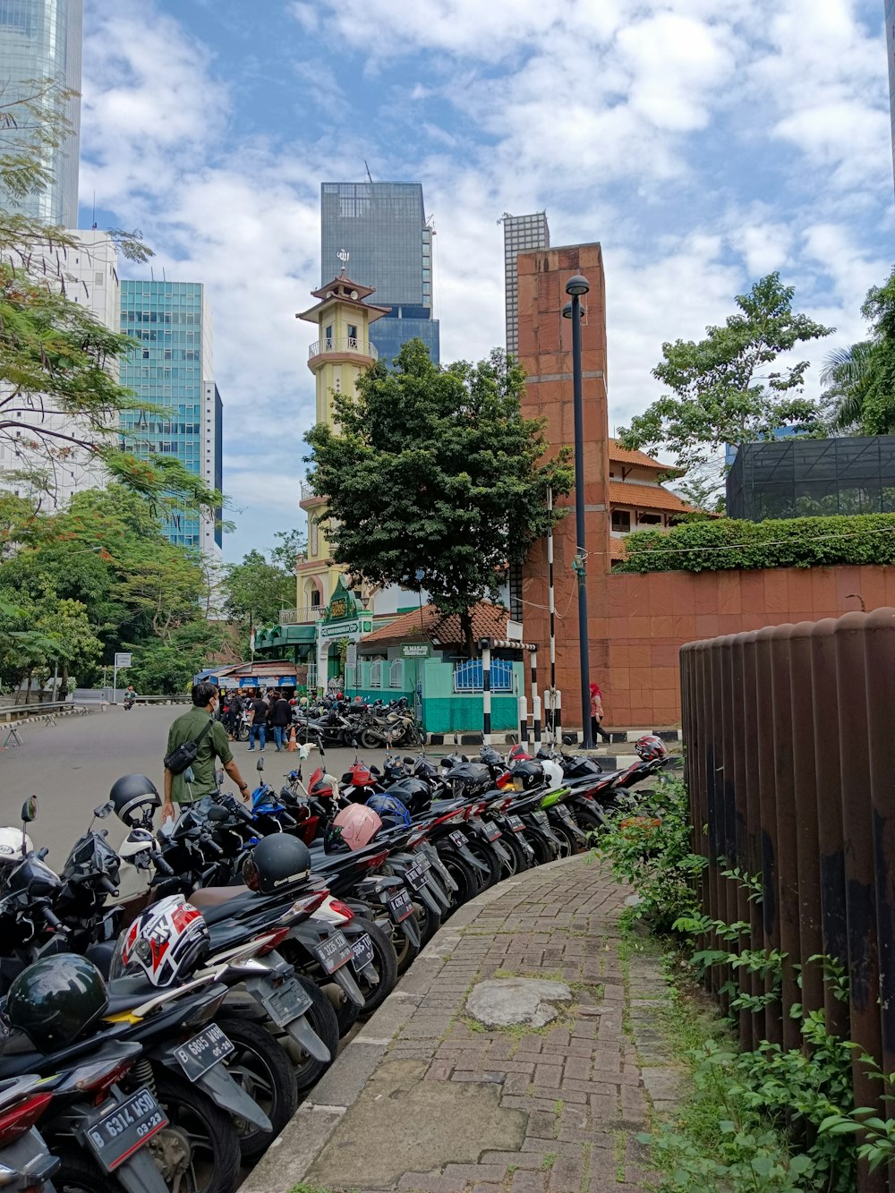 a group of motorcycles parked on the side of a road