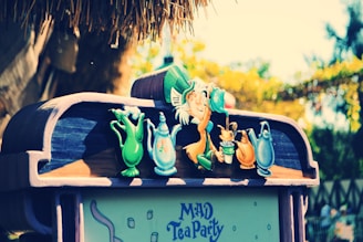 A whimsical image of Emily the haunted doll at a tea setting.