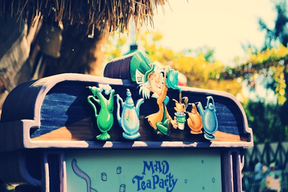 A whimsical image of Emily the haunted doll at a tea setting.