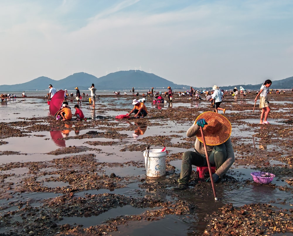 people working in a muddy area