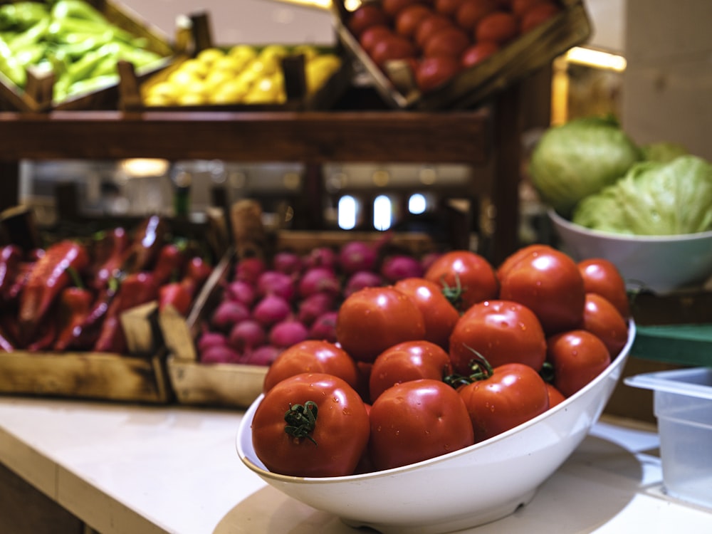 a bowl of tomatoes and other vegetables