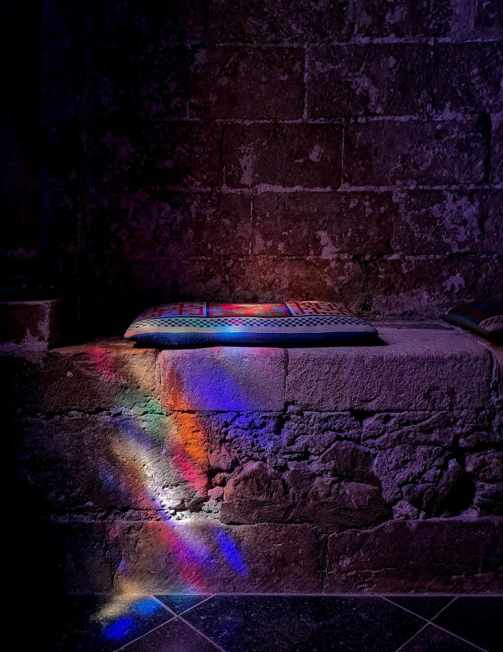 a brick wall with a light shining on it