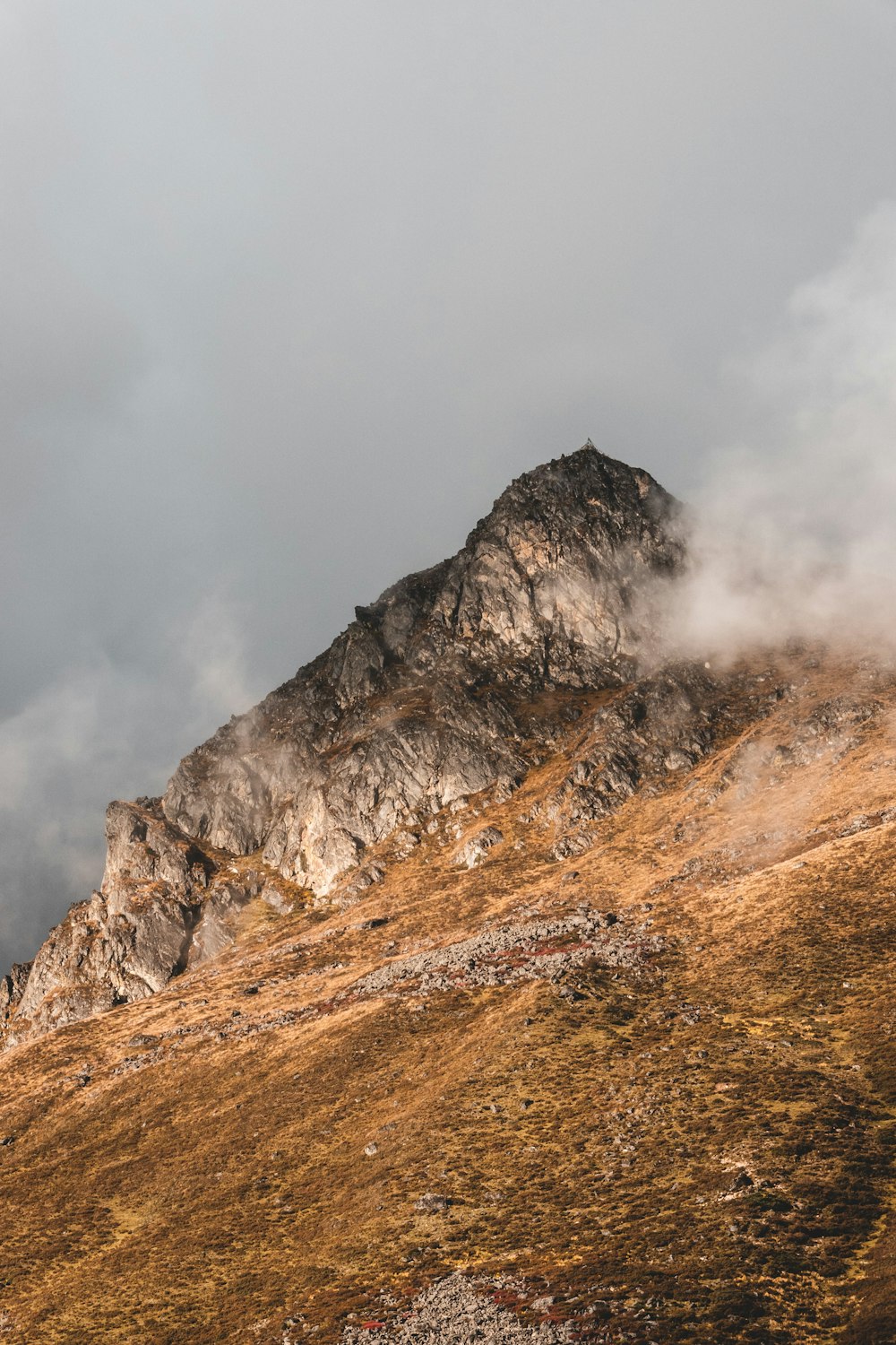 a mountain with clouds