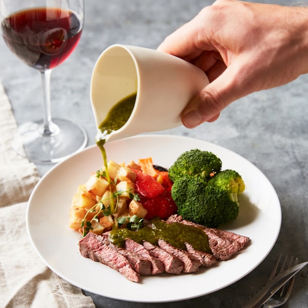 A plate of food and a glass of wine
