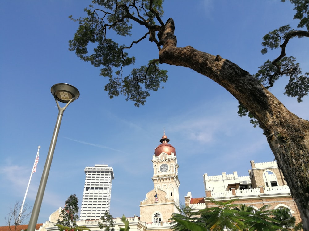 a clock tower next to a large building