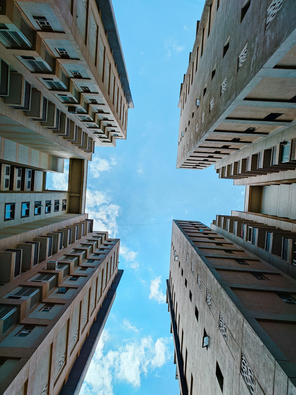 a group of buildings with balconies