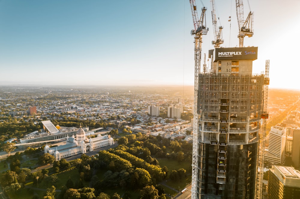 a tall building with a city in the background