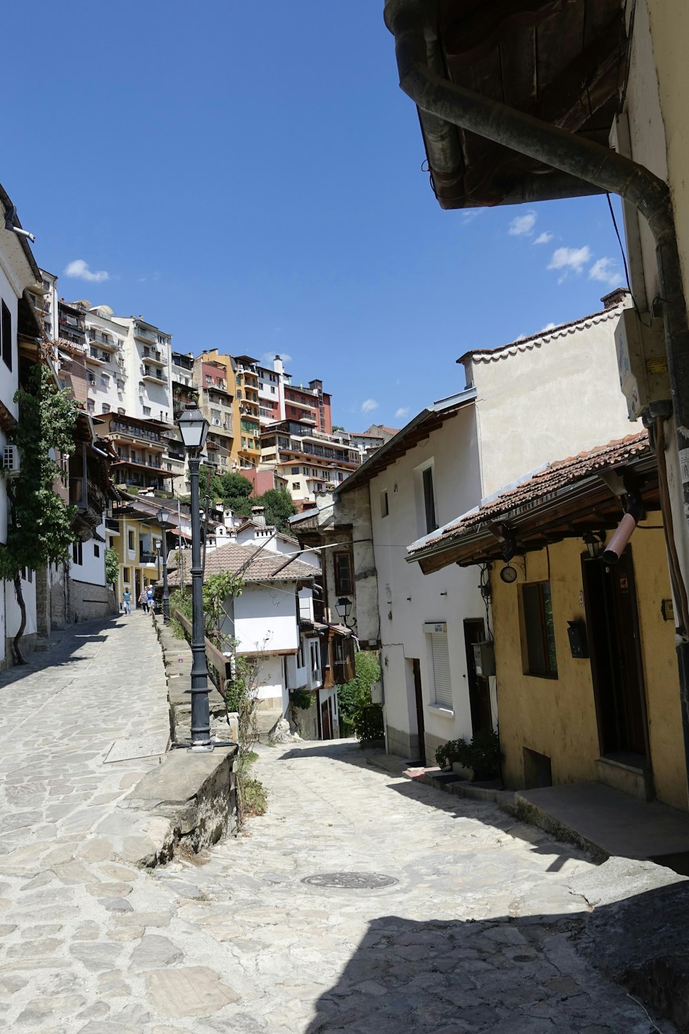 a cobblestone street with buildings on either side of it