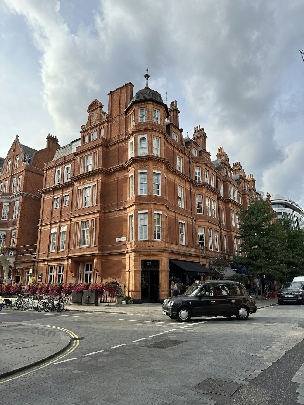 a large brick building with a parking lot in front of it