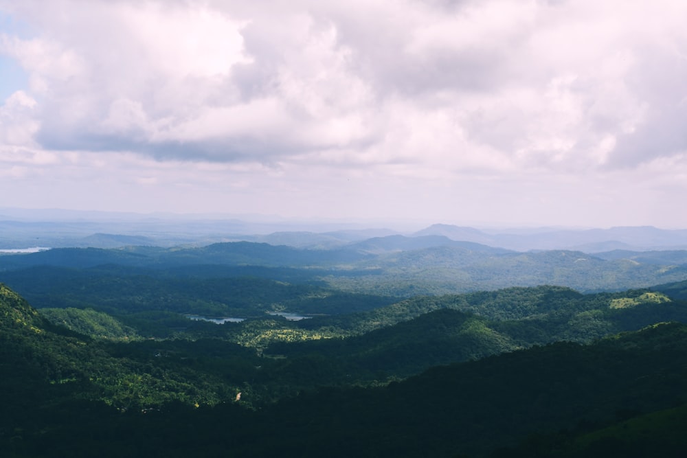 a landscape with hills and clouds